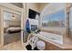 Bright bathroom features a soaking tub under a large window and adjacent to a bedroom at 2637 Ohio Ct, Las Vegas, NV 89128