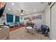 bedroom with a twin bed, a table with two chairs, and closet doors at 2637 Ohio Ct, Las Vegas, NV 89128