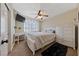 Cozy bedroom with a comfortable bed, white dresser, ceiling fan, and natural light from the window at 2637 Ohio Ct, Las Vegas, NV 89128