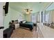 Cozy bedroom featuring neutral colors, ceiling fan, and lots of natural light at 2637 Ohio Ct, Las Vegas, NV 89128