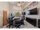 Spacious bonus room features a large table, entertainment center and walls decorated with board games at 2637 Ohio Ct, Las Vegas, NV 89128
