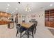Open concept kitchen and dining area with marble floors, and built in shelving at 2637 Ohio Ct, Las Vegas, NV 89128