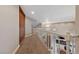 Upper hallway with a white railing and storage cabinets is leading to the main living space at 2637 Ohio Ct, Las Vegas, NV 89128