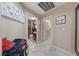 Hallway with entrances to other rooms, a flower decoration and artwork at 2637 Ohio Ct, Las Vegas, NV 89128