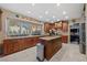 Bright kitchen featuring a center island, granite countertops, and stainless steel appliances at 2637 Ohio Ct, Las Vegas, NV 89128