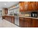 Spacious kitchen with granite countertops, stainless steel appliances, and wooden cabinetry at 2637 Ohio Ct, Las Vegas, NV 89128