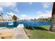 Beautiful lake view with clear water, palm trees, and a serene atmosphere at 2637 Ohio Ct, Las Vegas, NV 89128