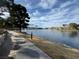 Scenic lake view with a walking path and mature trees adding natural beauty to the landscape at 2637 Ohio Ct, Las Vegas, NV 89128
