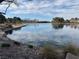 Scenic view of a lake with still water, reflecting the sky and surrounding community at 2637 Ohio Ct, Las Vegas, NV 89128