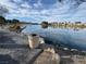 Scenic lake view featuring a paved walkway, tranquil water, and residential buildings in the distance at 2637 Ohio Ct, Las Vegas, NV 89128