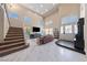Spacious living room with a tall ceiling, lots of natural light, and a cozy seating area at 2637 Ohio Ct, Las Vegas, NV 89128