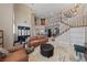 Inviting living area with a high ceiling, neutral walls, staircase, and comfortable seating at 2637 Ohio Ct, Las Vegas, NV 89128
