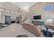 Bright, open living area with a soaring ceiling, staircase, large windows, and neutral decor at 2637 Ohio Ct, Las Vegas, NV 89128