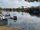Picturesque view of a marina on a calm lake, featuring several docks and boats at 2637 Ohio Ct, Las Vegas, NV 89128