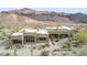 Beautiful home featuring desert landscaping against mountain backdrop at 26425 Park St, Nelson, NV 89005