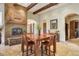 Dining area with a fireplace and access to other rooms at 26425 Park St, Nelson, NV 89005
