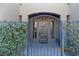 Wrought iron gate leading to front door with decorative details at 26425 Park St, Nelson, NV 89005