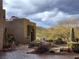Charming property nestled in the desert featuring xeriscaping with a variety of native plants and cacti at 26425 Park St, Nelson, NV 89005