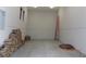 Spacious garage with firewood storage, providing ample space for vehicles and storage solutions at 26425 Park St, Nelson, NV 89005