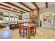 Bright kitchen with wood beam ceilings, an island, and a fireplace at 26425 Park St, Nelson, NV 89005