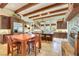 Kitchen featuring stainless appliances, large island, and a dining area near the stone fireplace at 26425 Park St, Nelson, NV 89005