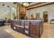 Kitchen island features an apron sink with seating, storage, and modern appliances at 26425 Park St, Nelson, NV 89005
