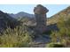 Scenic desert landscape featuring unique rock formations and native vegetation, offering a glimpse of the area's natural beauty at 26425 Park St, Nelson, NV 89005