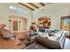 Bright living room featuring hardwood floors and access to the kitchen at 26425 Park St, Nelson, NV 89005