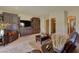 Cozy living room with built-in shelving and views of the desert landscape at 26425 Park St, Nelson, NV 89005