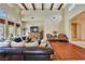 Open living room with high ceilings, exposed beams, and natural light at 26425 Park St, Nelson, NV 89005