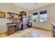 This office features custom dark wood desk and cabinets and a beautiful view of the desert landscape at 26425 Park St, Nelson, NV 89005