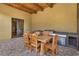 Inviting outdoor dining area featuring a built-in grill and a charming wooden dining table at 26425 Park St, Nelson, NV 89005