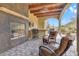 Comfortable outdoor seating area with fireplace and bar, perfect for relaxation and entertaining guests at 26425 Park St, Nelson, NV 89005
