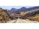 Scenic view of a long road stretching through the desert mountains at 26425 Park St, Nelson, NV 89005