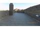 Large rooftop deck with tile flooring, parapet and mountain views at 26425 Park St, Nelson, NV 89005