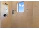 Close-up of tiled shower with window and built-in shelf at 26425 Park St, Nelson, NV 89005