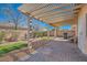 Private backyard featuring a pergola, a brick patio, a grill, and desert landscaping at 2724 Rosarito St, Las Vegas, NV 89108