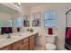 Bright bathroom with a large mirror, framed artwork, and a glass-enclosed shower at 2724 Rosarito St, Las Vegas, NV 89108