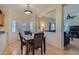 Dining area featuring views of living area and access to backyard at 2724 Rosarito St, Las Vegas, NV 89108
