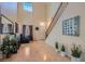 Entryway with soaring ceiling, leading to the living room. Hardwood floors and natural light at 2724 Rosarito St, Las Vegas, NV 89108