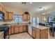 Well-lit kitchen with stainless appliances, granite countertops, and a breakfast bar at 2724 Rosarito St, Las Vegas, NV 89108