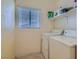 Functional laundry room with a window and washer and dryer hookups at 2724 Rosarito St, Las Vegas, NV 89108