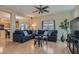 Inviting living room with hardwood floors, large sectional sofa, and a bright, open layout at 2724 Rosarito St, Las Vegas, NV 89108
