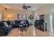 Comfortable living room with hardwood floors, ceiling fan, and ample natural light at 2724 Rosarito St, Las Vegas, NV 89108