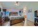 Spacious main bedroom featuring hardwood floors, a ceiling fan, and a walk-in closet at 2724 Rosarito St, Las Vegas, NV 89108