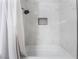 Shower tub combination with white marble tile at 3062 Tarpon Dr # 201, Las Vegas, NV 89120
