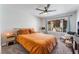 Bedroom with plush carpet, ceiling fan, and natural light at 3062 Tarpon Dr # 201, Las Vegas, NV 89120