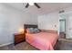 Neutral bedroom featuring a ceiling fan and updated floors at 3062 Tarpon Dr # 201, Las Vegas, NV 89120