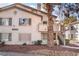 Charming condo featuring a private balcony with stone landscaping and stairs to entry at 3062 Tarpon Dr # 201, Las Vegas, NV 89120