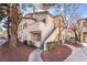 Attractive condo showcasing stairs to private balcony and appealing landscaping at 3062 Tarpon Dr # 201, Las Vegas, NV 89120